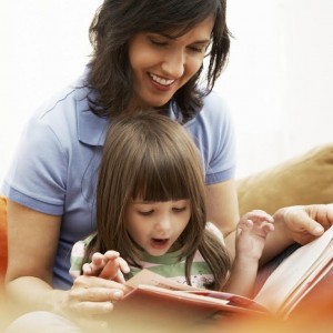 Mother and Daughter Reading Together --- Image by © Royalty-Free/Corbis