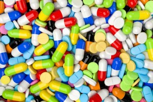 Medical background with colorful pills and capsules. Realistic 3D render